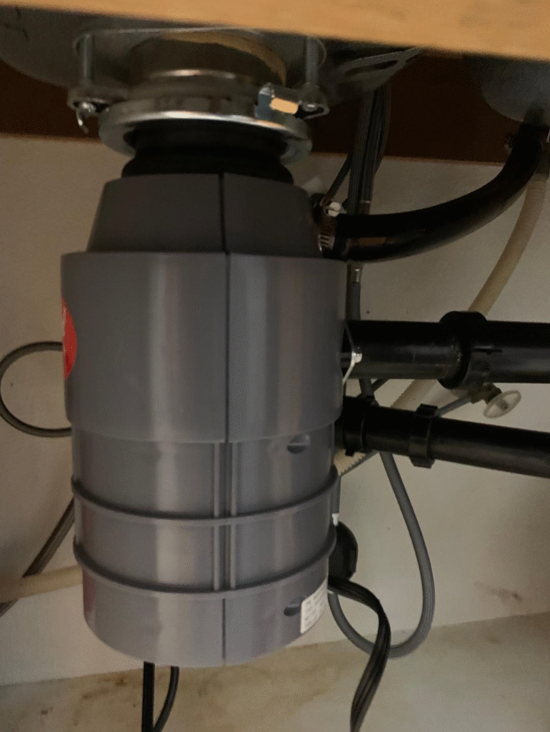Garbage disposal unit installed under kitchen sink in Las Vegas home