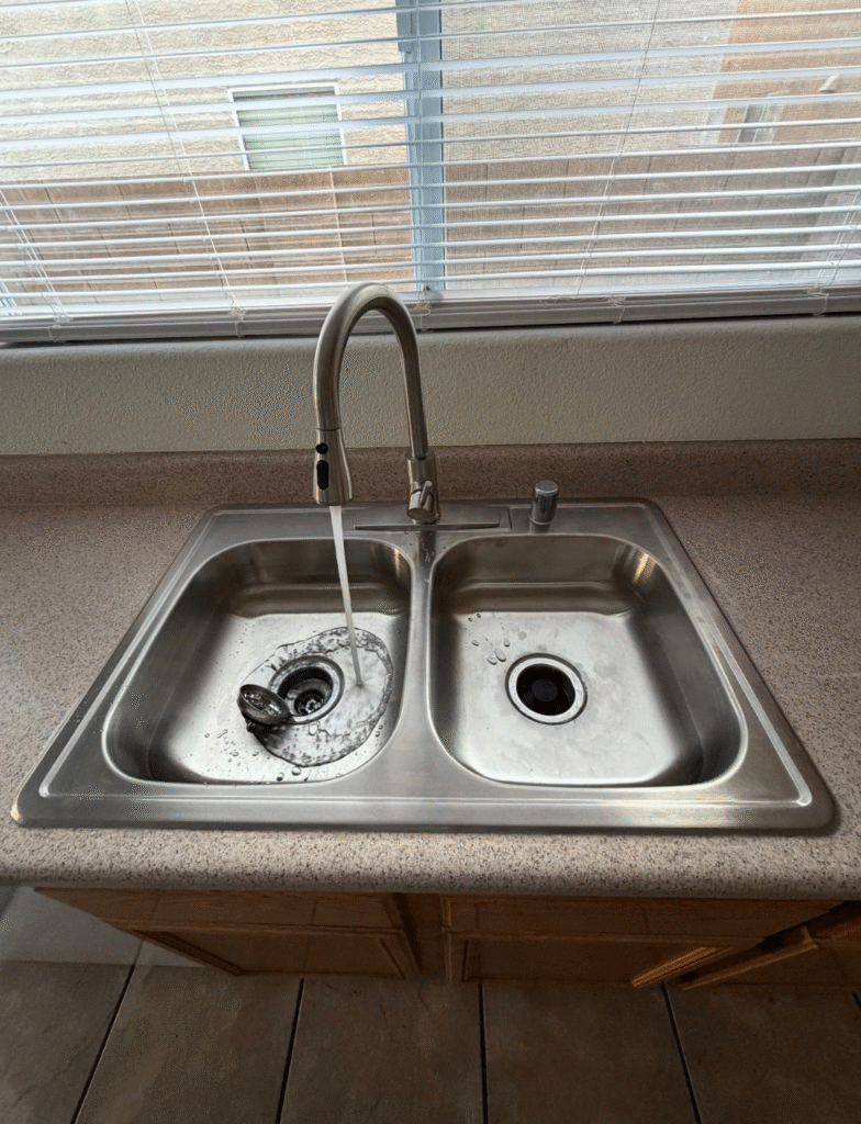 Kitchen sink faucet repair in Las Vegas NV showing water flow after service