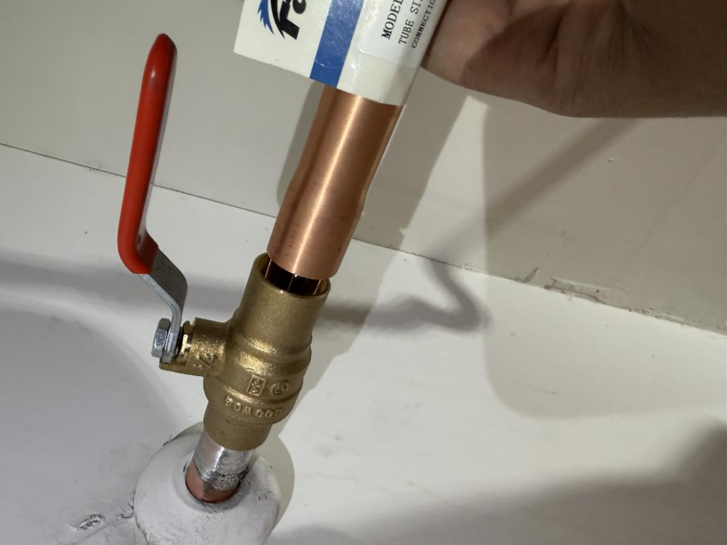Main water line repair in Las Vegas showing copper pipe and shutoff valve installation