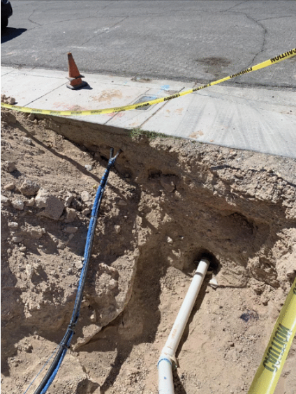 Exposed sewer line and caution tape during sewer repair in Las Vegas NV