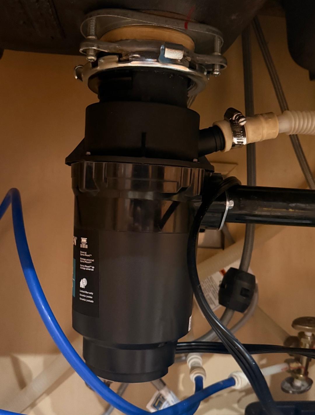 New garbage disposal unit installed under kitchen sink in Las Vegas, NV