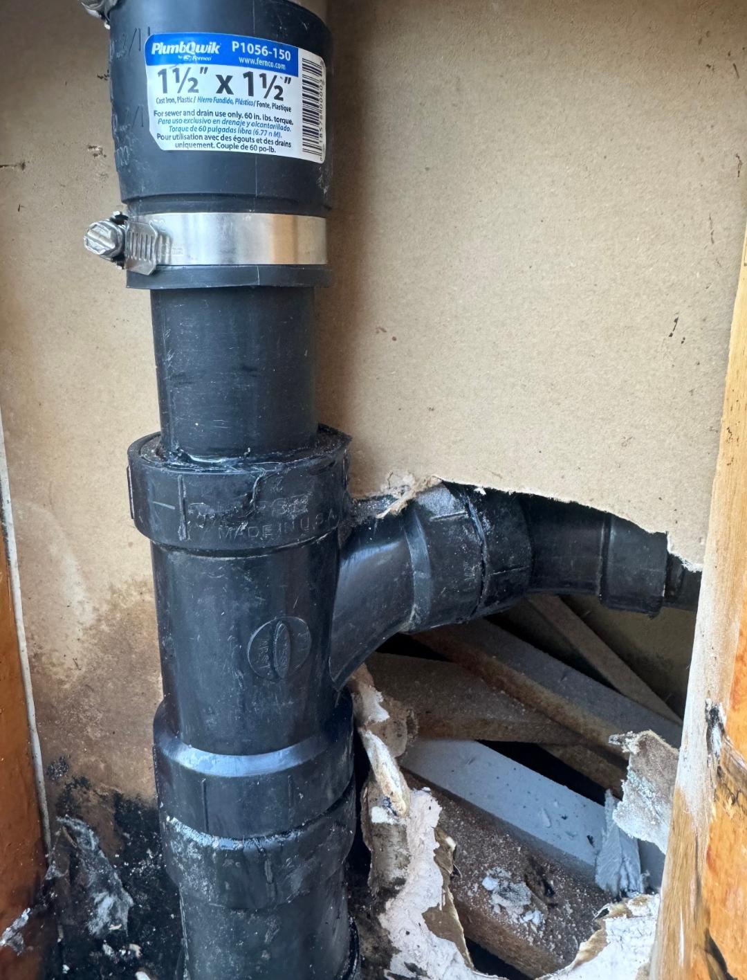 Rubber coupling connecting ABS sewer drain line during sewer line repair in Las Vegas, NV