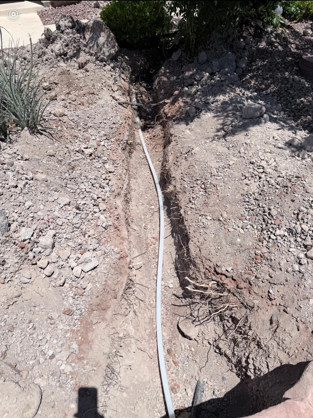 New water line pipe laid in excavated trench during water line repair service in Las Vegas, NV